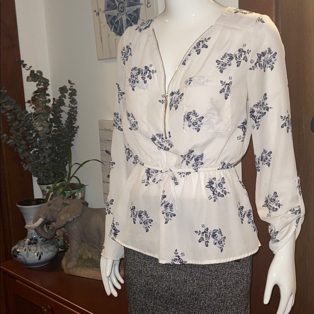 Floral Print Blouse with Blue Accents size M. Zips up to collar